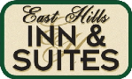A sign that says east hills inn and suites.